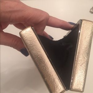Gold metallic evening clutch with snap closure